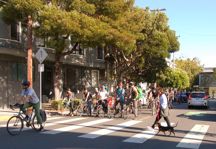 Bicyclists in San Francisco showed what happens if they follow the letter of the law at stop signs. Photo by Aaron Bialick
