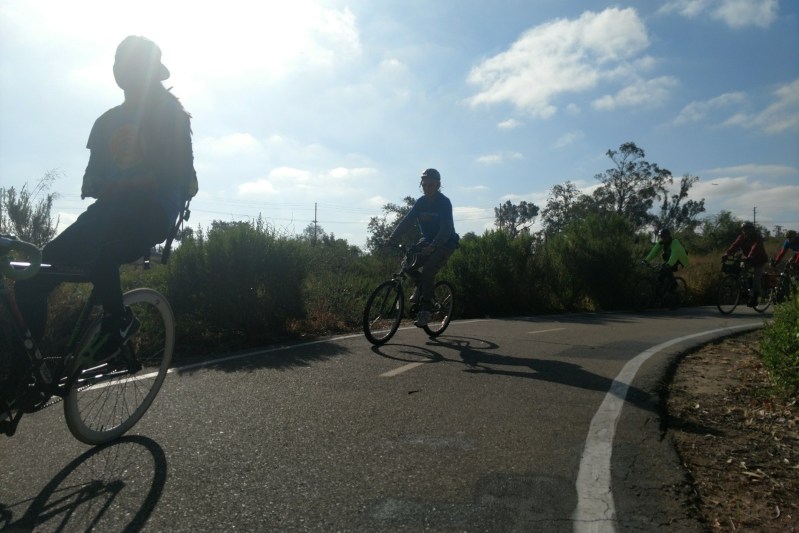 Bicyclists round a curve on the Santiago Creek Bike Path in Orange during Orange County Transportation Authority's annual bike rally. Photos by Kristopher Fortin