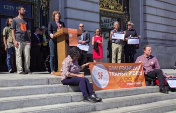 lanked by transit-riding volunteers, lawmakers and officials, Rachel Hyden kicked off Transit Week. Photo: Streetsblog/Rudick