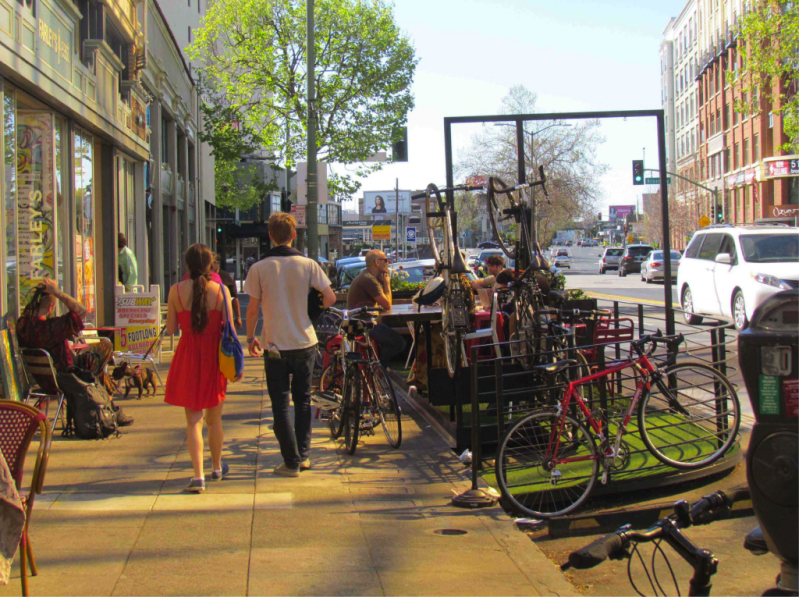 A parklet on Grand Avenue in Oakland the expanded seating area for a coffee shop, and created a place for people to gather. Photo by Melanie Curry/Streetsblog