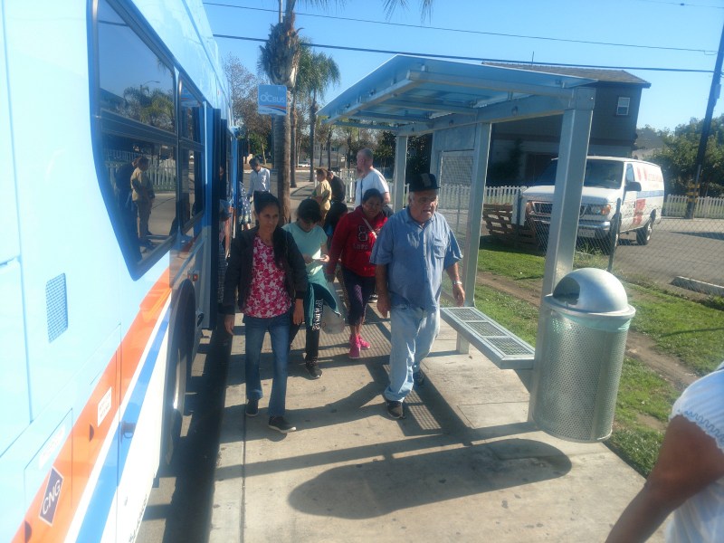 Bus riders exit the 66 OC Bus line at Mcfadden Avenue. More than 41 bus shelters are being installed in Santa Ana, with 22 being located in the Main Street corridor. Kristopher Fortin/Streetsblog CA