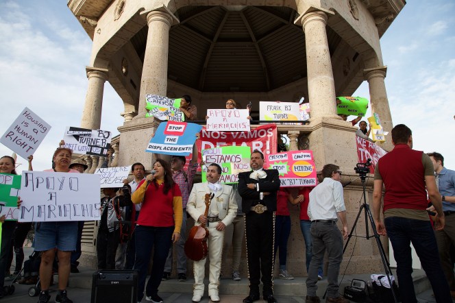 Mariachi musician Luis Valdivia (white suit, center) waits to address the crowd regarding an $800 rent increase he was hit with at a rally at Mariachi Plaza in April, 2017. Sahra Sulaiman/Streetsblog L.A.