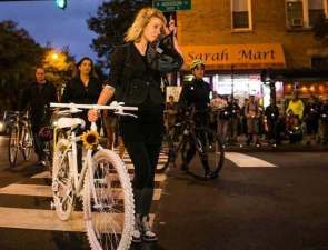 Kristen Green brings a ghost bike to the corner of Addison and Damen, where health coach Anastasia Kondrasheva, 23, was fatally struck on her bike by a right-turning truck driver in September 2016.