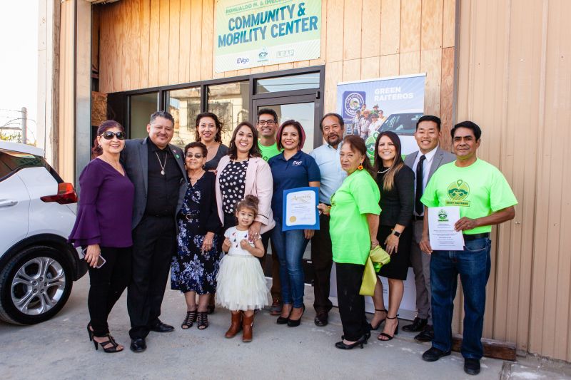From left, Lucila C. Martinez; Mayor Rey León; Imelda León; Esperanza Vielma, LEAP Institute board; Michelle Romero, Green for All National Director, with her daughter; Reyes Barboza Jr., Green Raiteros Director of Operations; Monica Torres, EVgo; Alvaro Preciado, Mayor of Avenal; Carmen Lopez, Green Raitera (driver); Esmeralda Soria, President of Fresno City Council; Chongtoua Mouavangsou from Assemblymember Joaquin Arambula's office; and Green Raitero driver Gregorio Hernandez. Photo by Tim Daw (https://www.timdawphotography.com/)