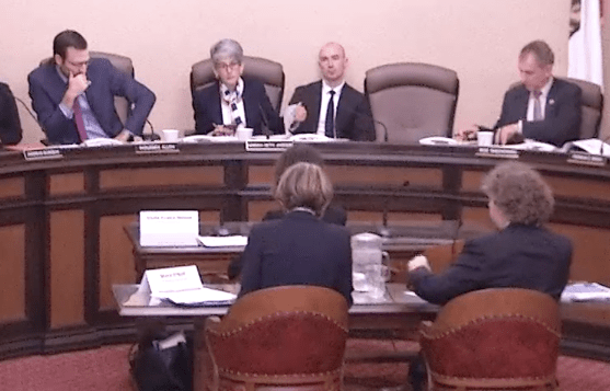Senators Ben Allen, Hannah-Beth Jackson, and Bob Wieckowski, from left at dais, listen to testimony on California Environmental Quality Act lawsuits
