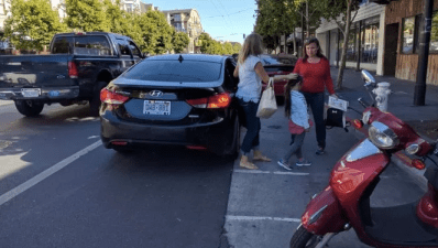 Photo of an Uber dropoff in a bike lane in San Francisco by Roger Rudick, Streetsblog SF