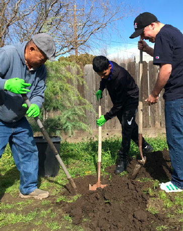Residents “greenlining the hood” in a vacant lot that has been transformed
into a community garden in South Stockton. Image: Rise Stockton
