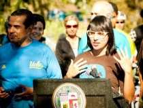 Adonia Lugo speaking in 2010 at the first CicLAvia open streets festival. Photo by CicLAvia